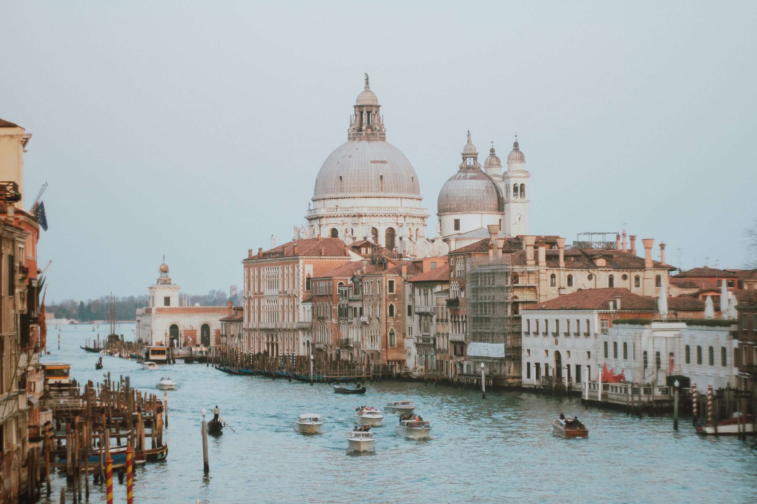 Beautiful view of Venice's canals with gondolas and historic buildings.